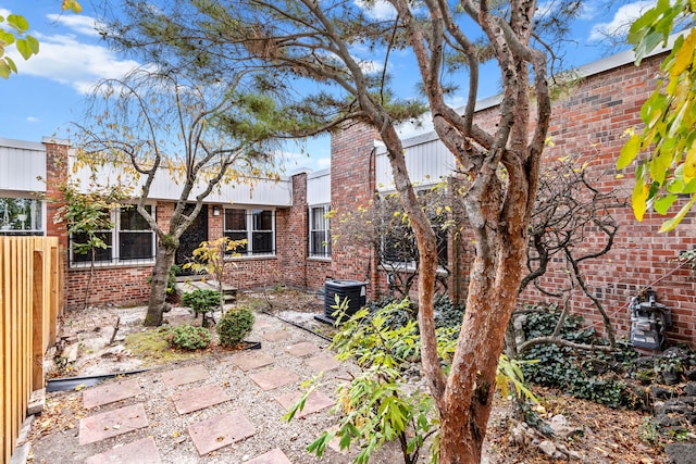 exterior space with central AC unit and a patio area