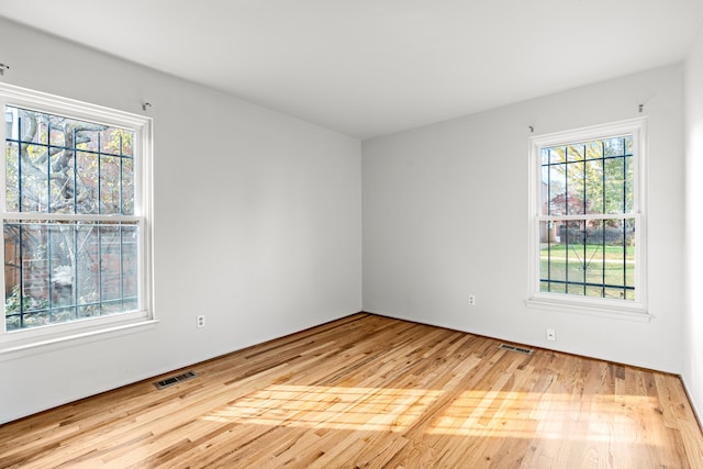 empty room with light hardwood / wood-style floors