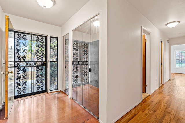 wine cellar featuring light wood-type flooring