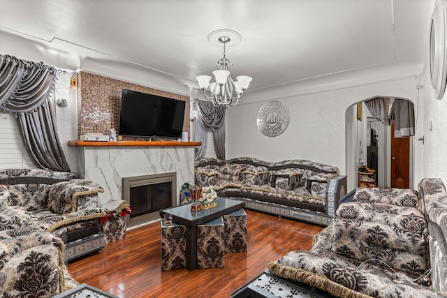 living room featuring dark hardwood / wood-style floors and a notable chandelier