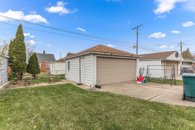 garage featuring a yard