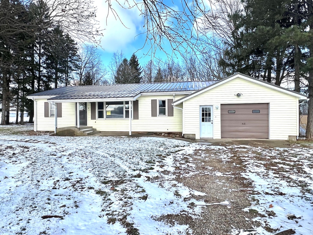 single story home with a garage