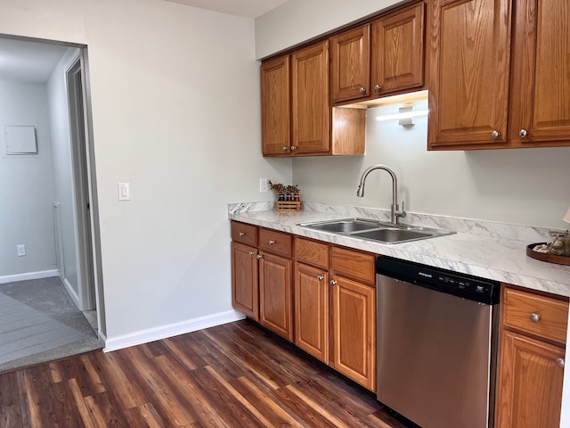 kitchen with dishwasher, dark wood-type flooring, and sink