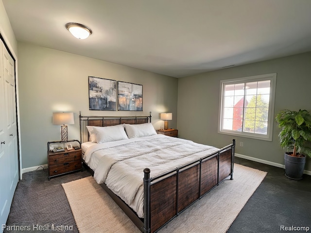 carpeted bedroom featuring a closet