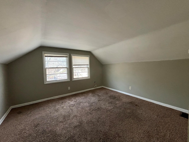 bonus room featuring carpet floors and lofted ceiling