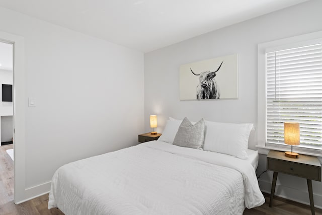 bedroom featuring hardwood / wood-style flooring