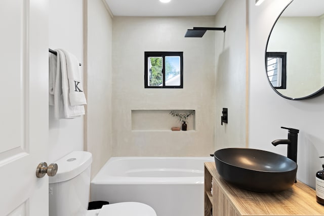 full bathroom featuring shower / tub combination, vanity, and toilet