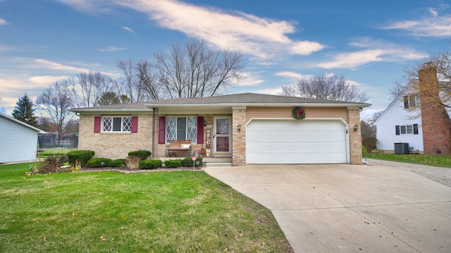 single story home with cooling unit, a garage, and a front lawn