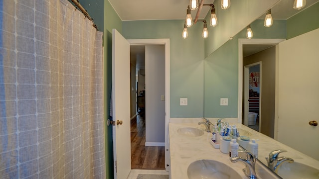 bathroom featuring vanity and hardwood / wood-style flooring