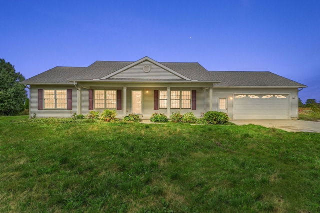 ranch-style home with a front yard and a garage