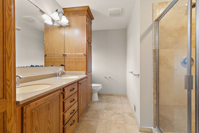 bathroom with vanity, toilet, and walk in shower