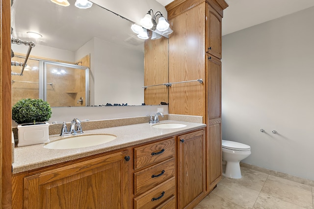 bathroom with vanity, toilet, and walk in shower