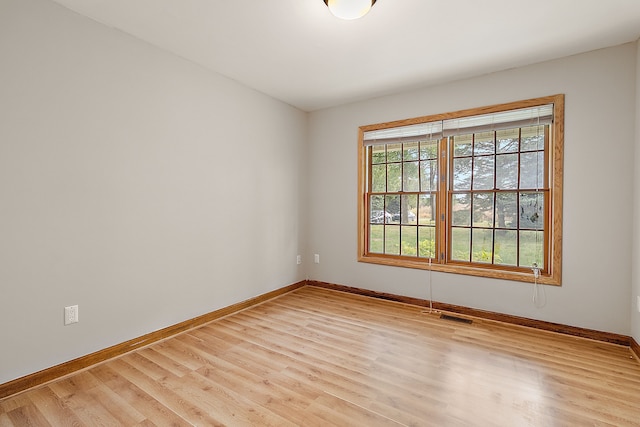 unfurnished room with light hardwood / wood-style flooring