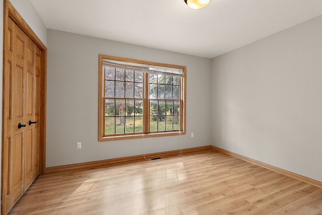 unfurnished room featuring light hardwood / wood-style flooring