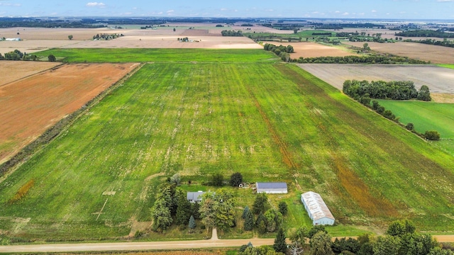 birds eye view of property with a rural view