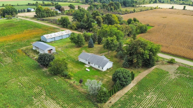 birds eye view of property with a rural view