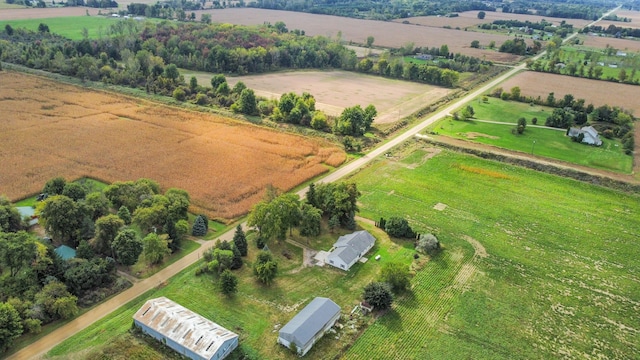 birds eye view of property with a rural view