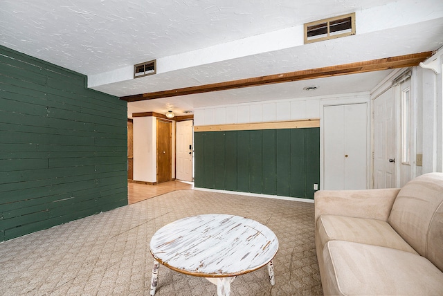 living room with wooden walls