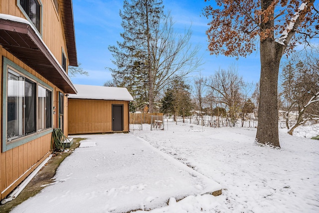 snowy yard with a trampoline