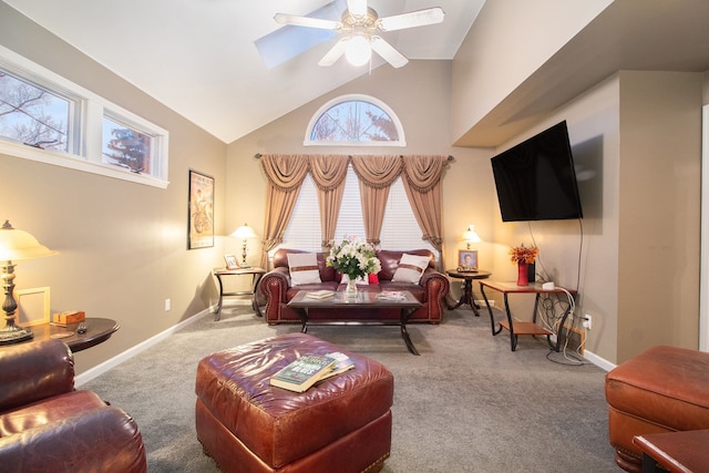 carpeted living room featuring ceiling fan and high vaulted ceiling