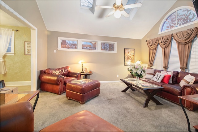 living room with carpet floors, vaulted ceiling, and ceiling fan