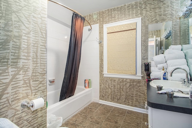 bathroom featuring shower / bath combo and vanity