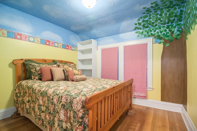 bedroom featuring hardwood / wood-style flooring