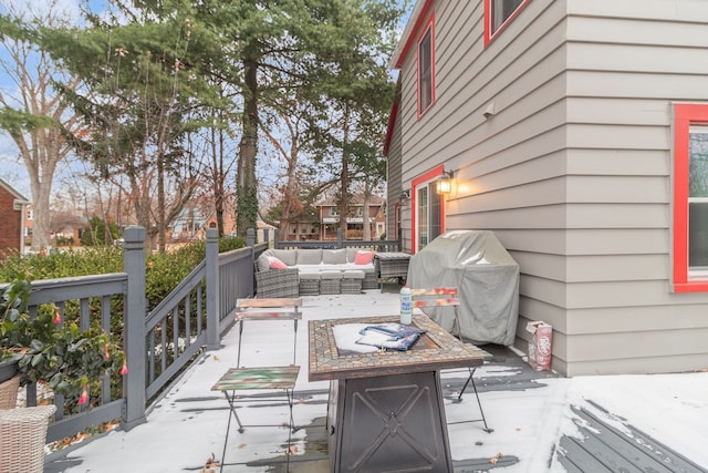 view of patio featuring area for grilling and an outdoor living space with a fire pit