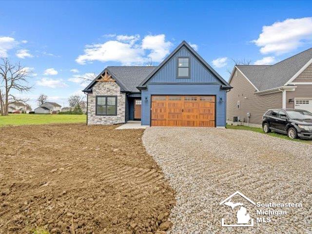 view of front of property featuring a garage