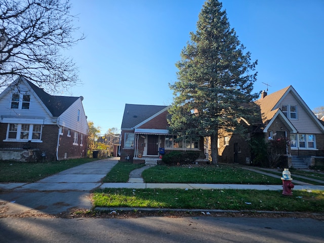 bungalow-style house with a front lawn