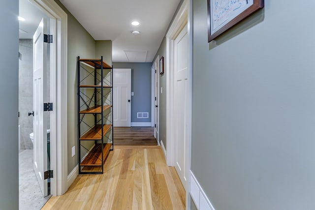 hall with light hardwood / wood-style floors