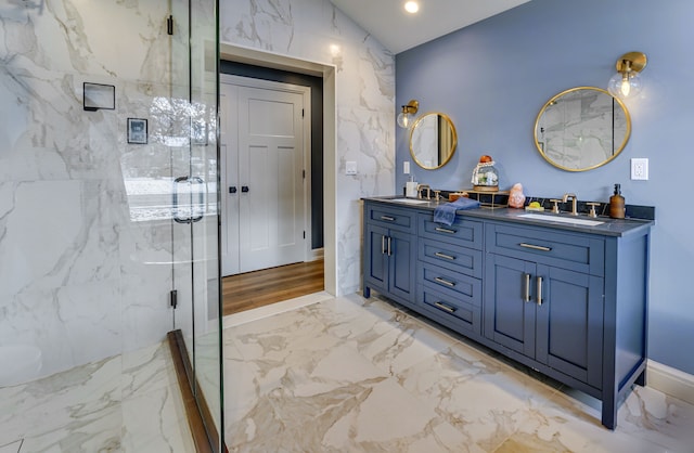 bathroom featuring vanity and a shower with shower door