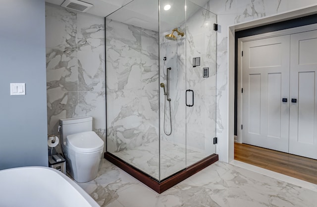 bathroom featuring separate shower and tub, tile walls, and toilet