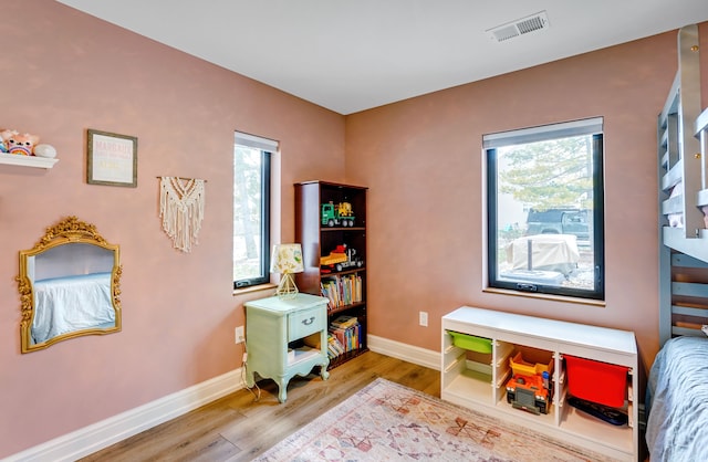 recreation room with hardwood / wood-style flooring