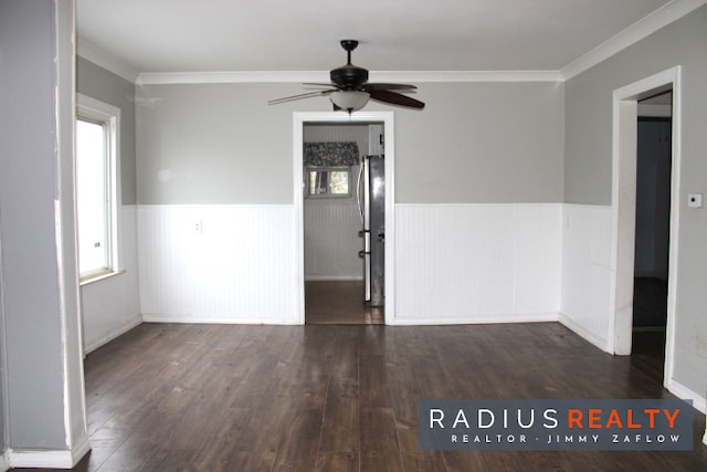 unfurnished room featuring dark hardwood / wood-style floors and a healthy amount of sunlight