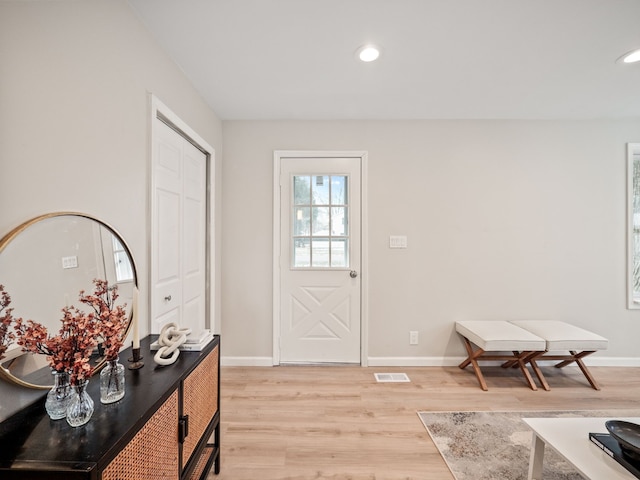 foyer entrance with light hardwood / wood-style floors