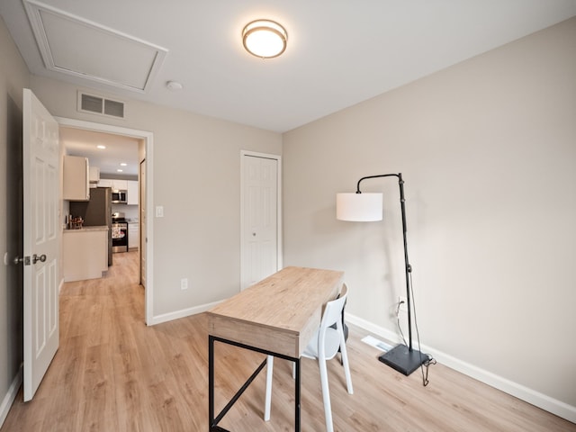 office space with light hardwood / wood-style floors