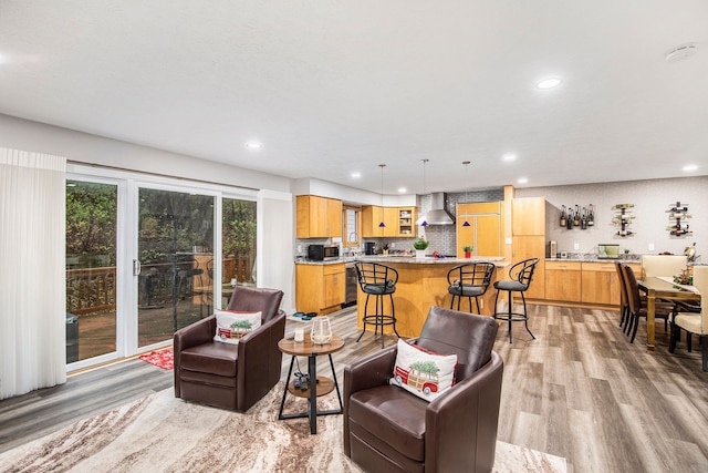 living room with recessed lighting and light wood-type flooring