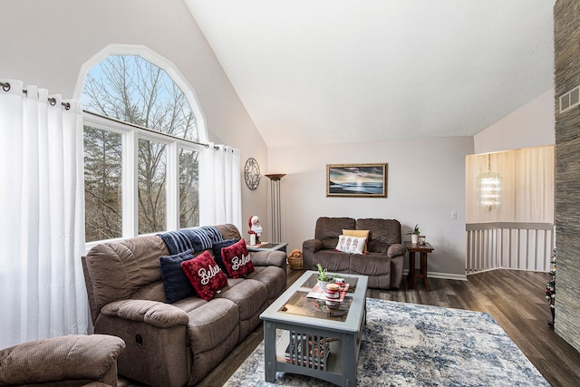 living area with high vaulted ceiling and dark wood-style flooring