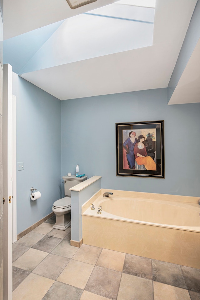 full bath with baseboards, toilet, and a garden tub