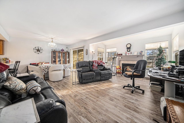 living room featuring hardwood / wood-style floors and a chandelier