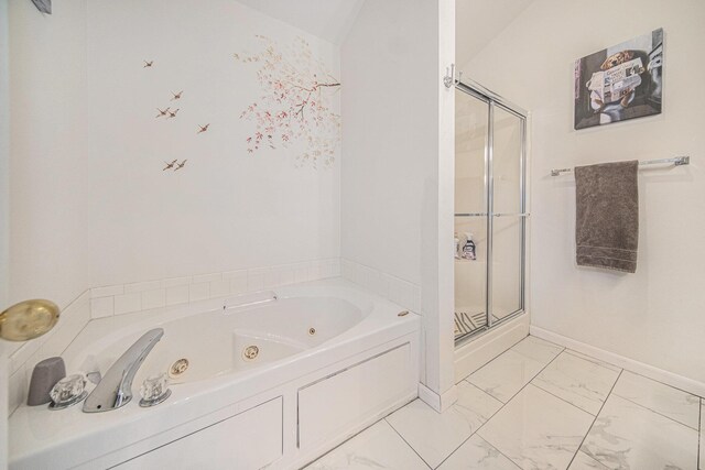 bathroom with vaulted ceiling and separate shower and tub