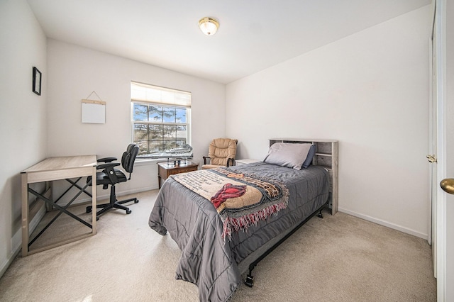 bedroom featuring light carpet