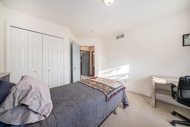 carpeted bedroom with a closet