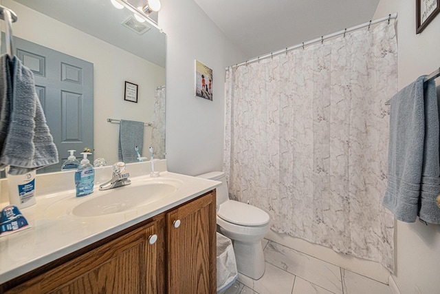 bathroom with vanity and toilet