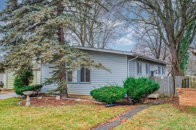 view of home's exterior with a yard