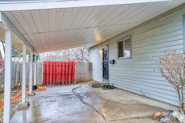 1930 Whittlesey St, Flint, MI 48503 - view of patio / terrace with an attached carport and fence
