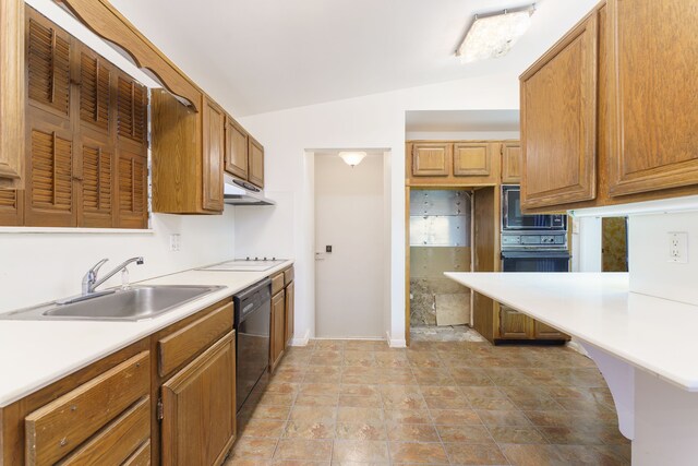 1930 Whittlesey St, Flint, MI 48503 - kitchen featuring vaulted ceiling, black appliances, light countertops, and a sink