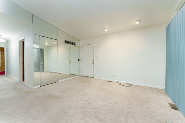 1930 Whittlesey St, Flint, MI 48503 - unfurnished bedroom with baseboards, visible vents, and light colored carpet
