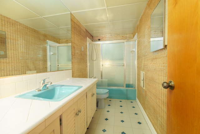 1930 Whittlesey St, Flint, MI 48503 - full bath featuring combined bath / shower with glass door, wallpapered walls, toilet, and vanity